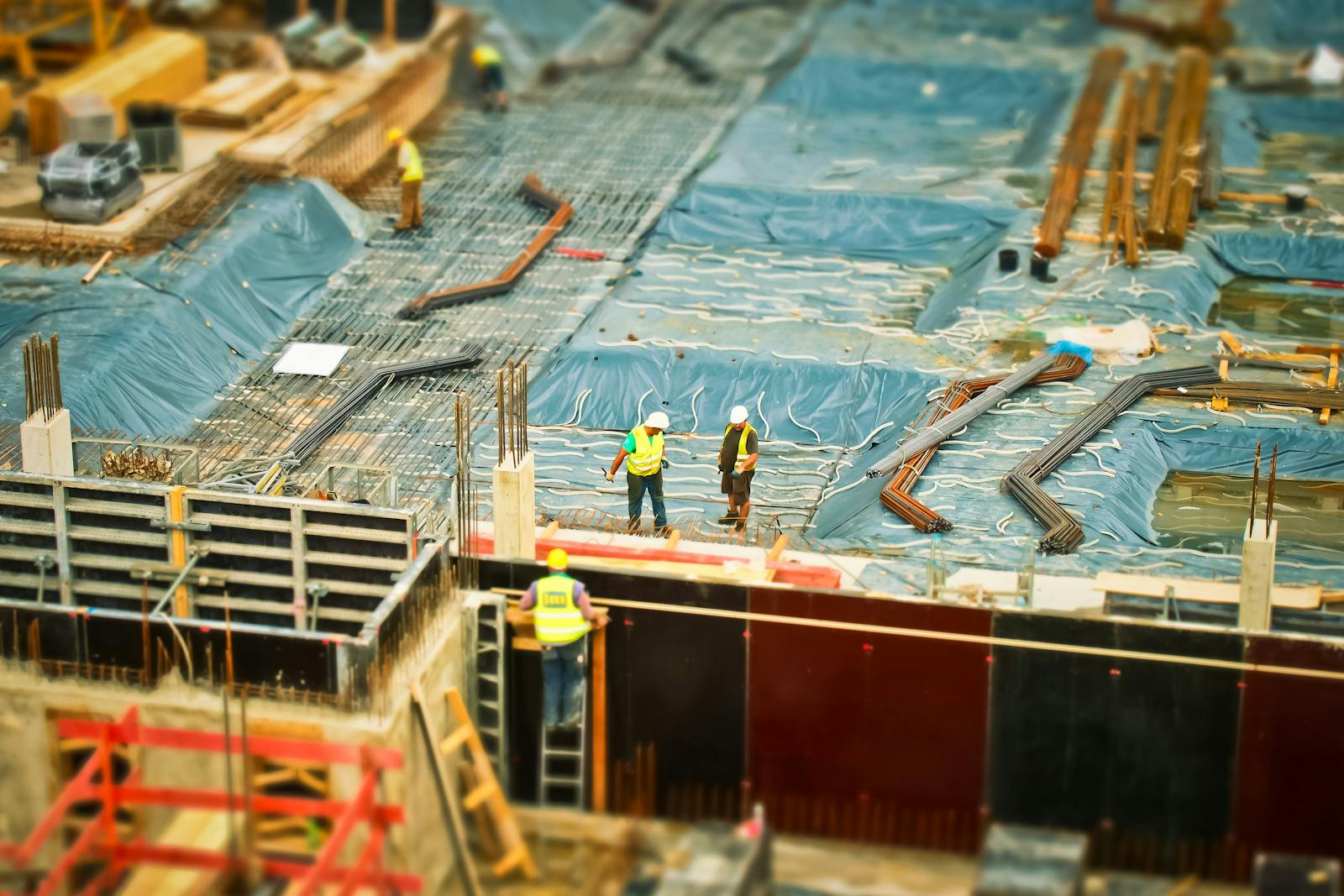 Photo by Pixabay High-angle view of construction workers on a building site, engaging in construction work.